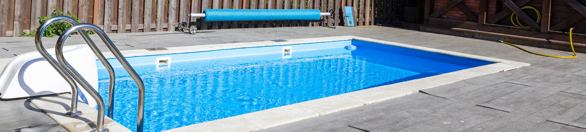 Backyard pool with wooden decking